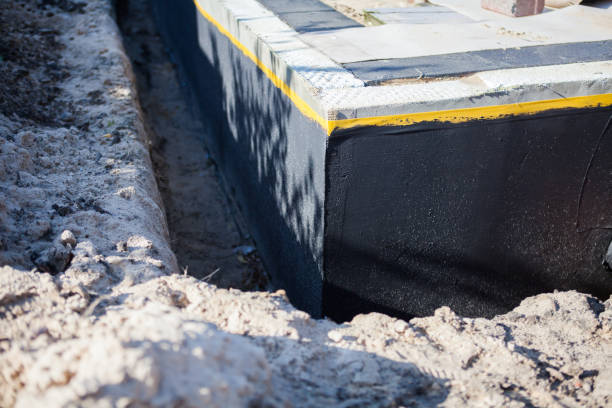 Professional Waterproofing technician working in Howard, WI